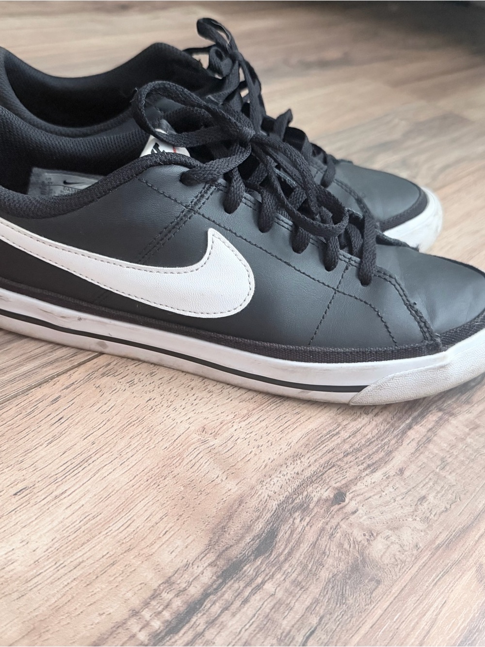 Nike Black Leather Low-Top Sneakers with White Swoosh and Trim